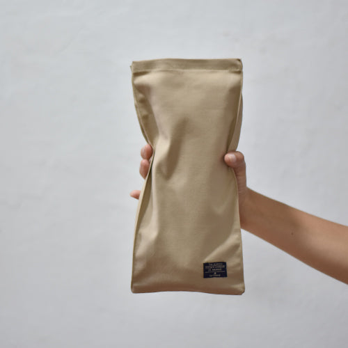 Bolsa kraft plegable de tela con un pan dentro: Fácil de almacenar y llevar contigo en todo momento